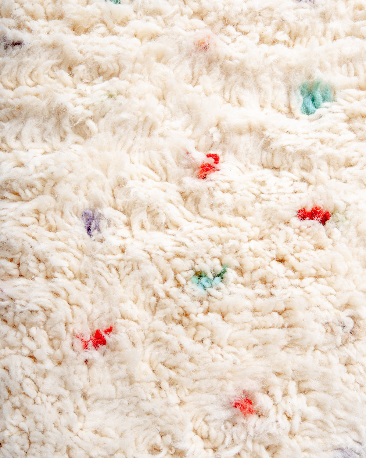 Modern, designer, handcrafted Berber rug from Morocco. Beniourain carpet with beautiful colours and patterns and fluffy wool texture.